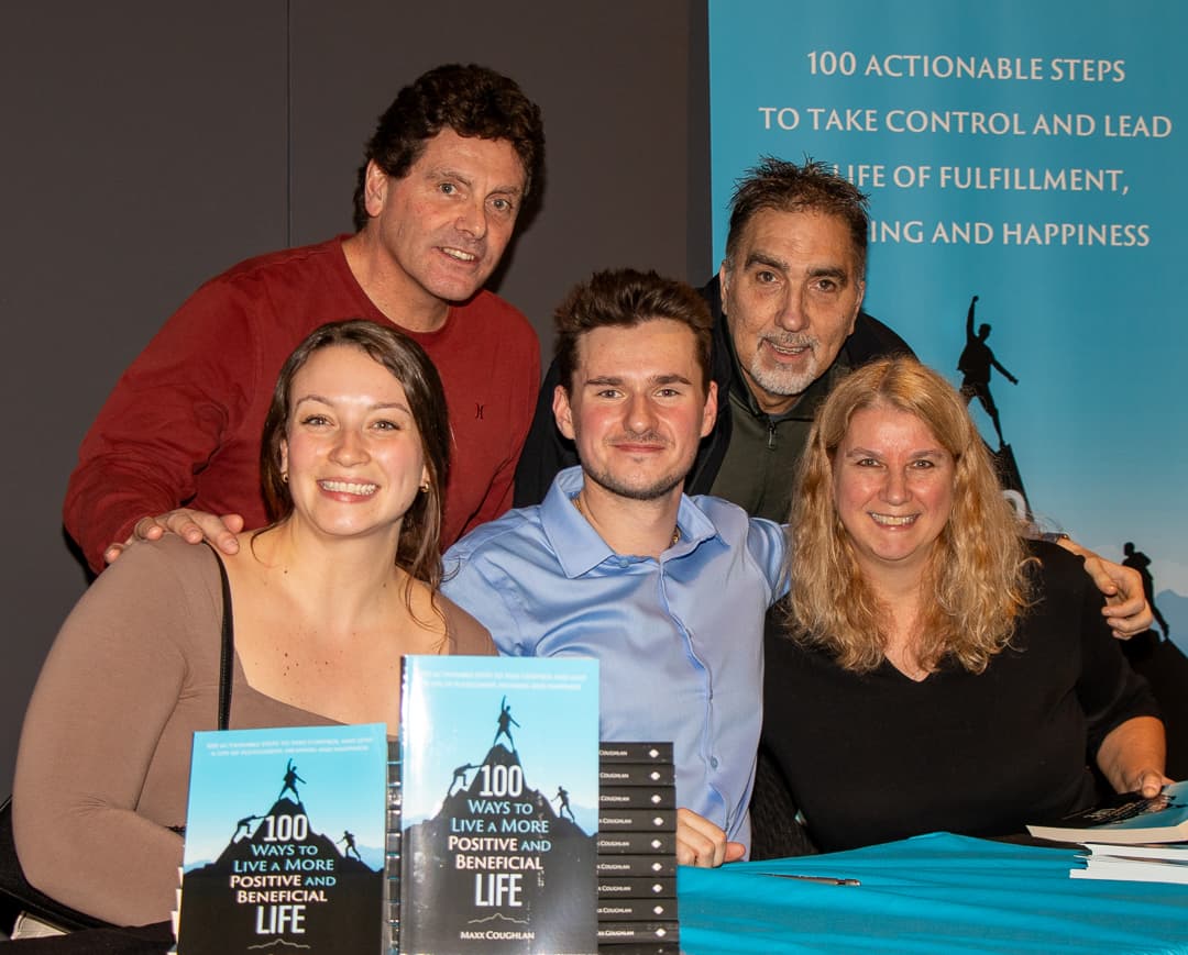 Family at signing table